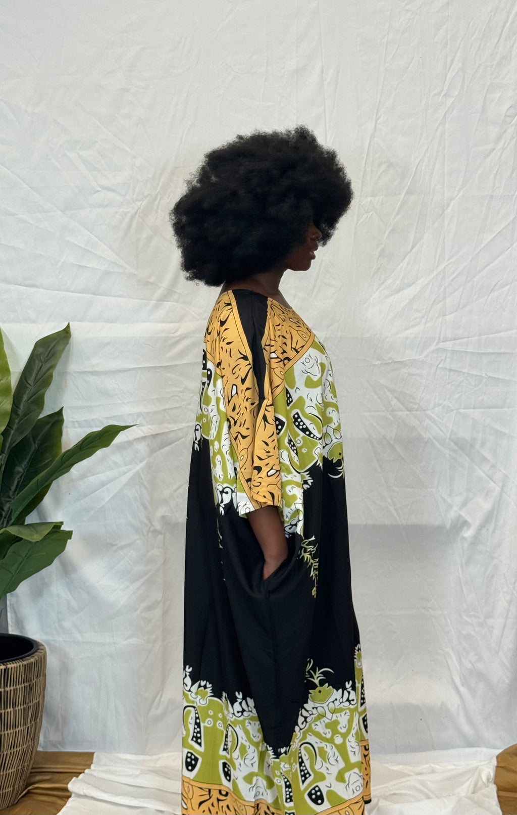 Black woman wearing colorful kaftan 