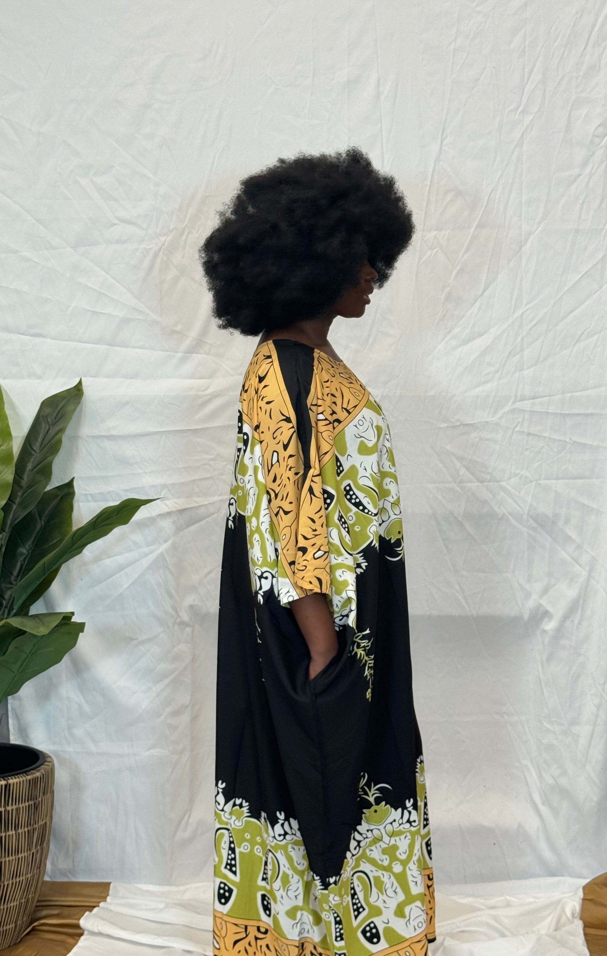 Black woman wearing colorful kaftan 