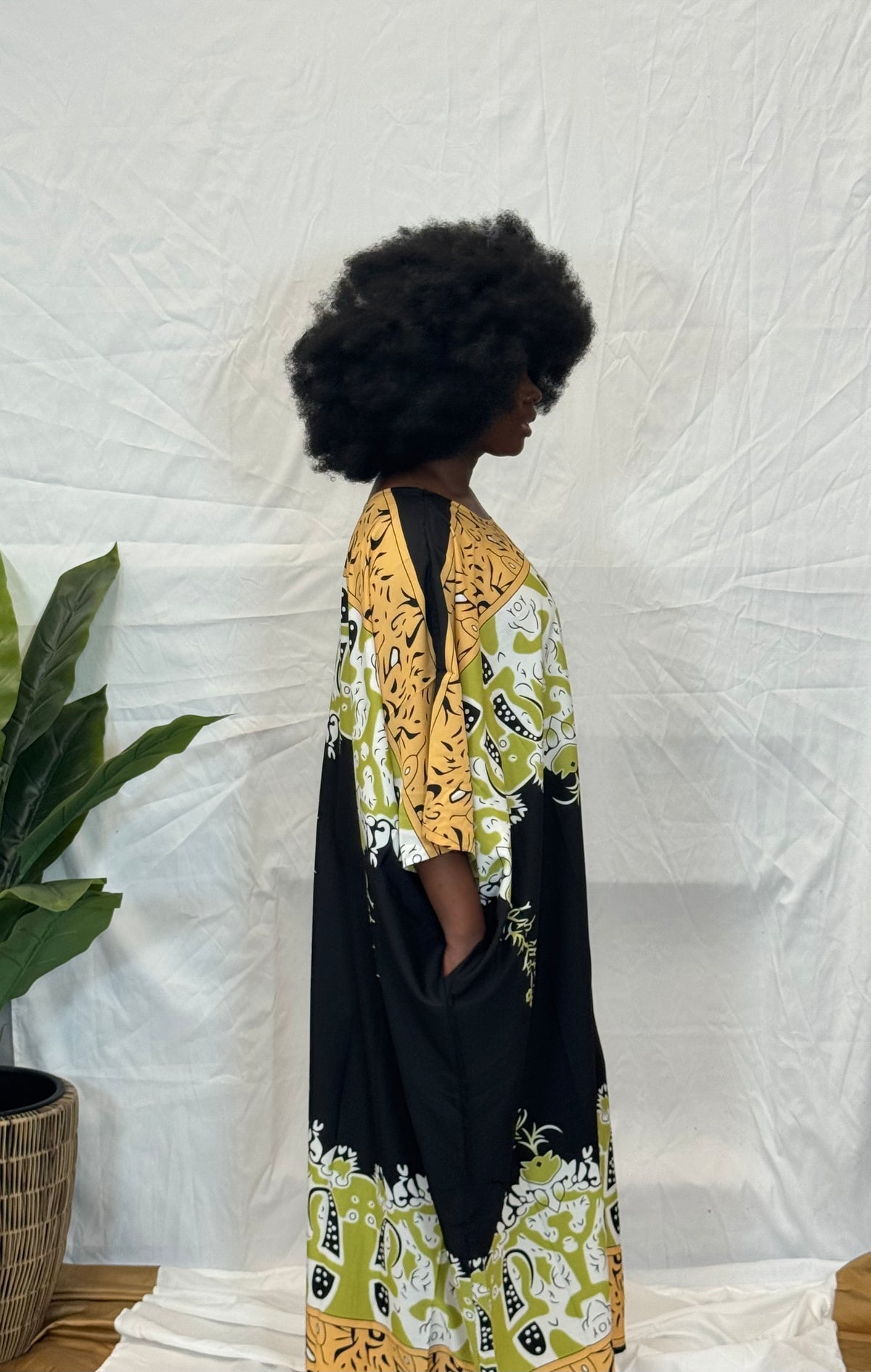 Black woman wearing colorful kaftan 