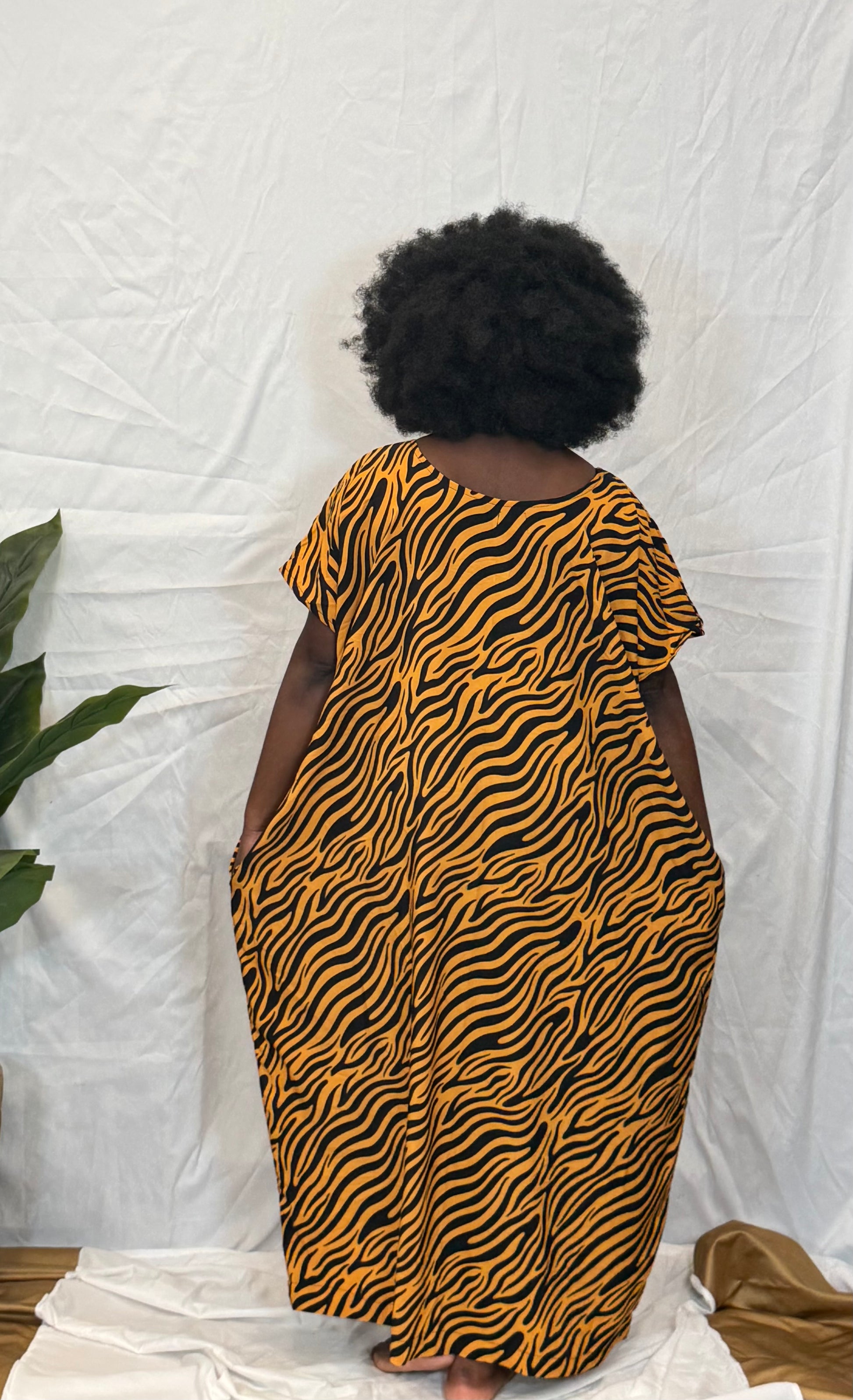 Black woman wearing colorful kaftan 