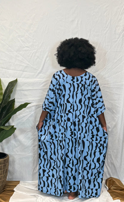 Black woman wearing bright colorful kaftan