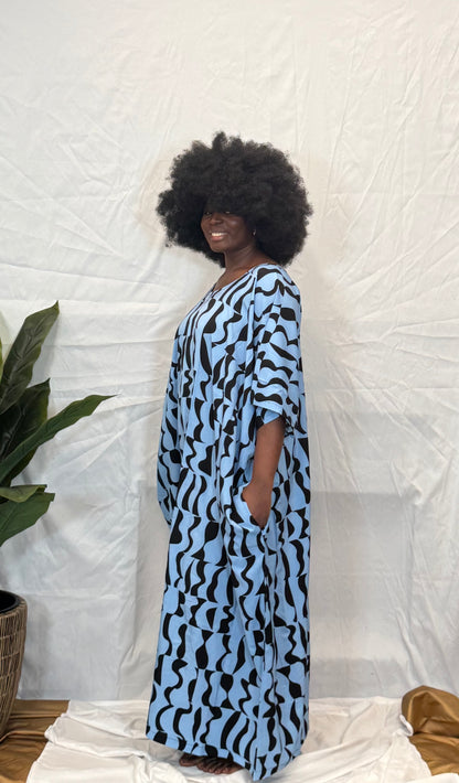 Black woman wearing bright colorful kaftan