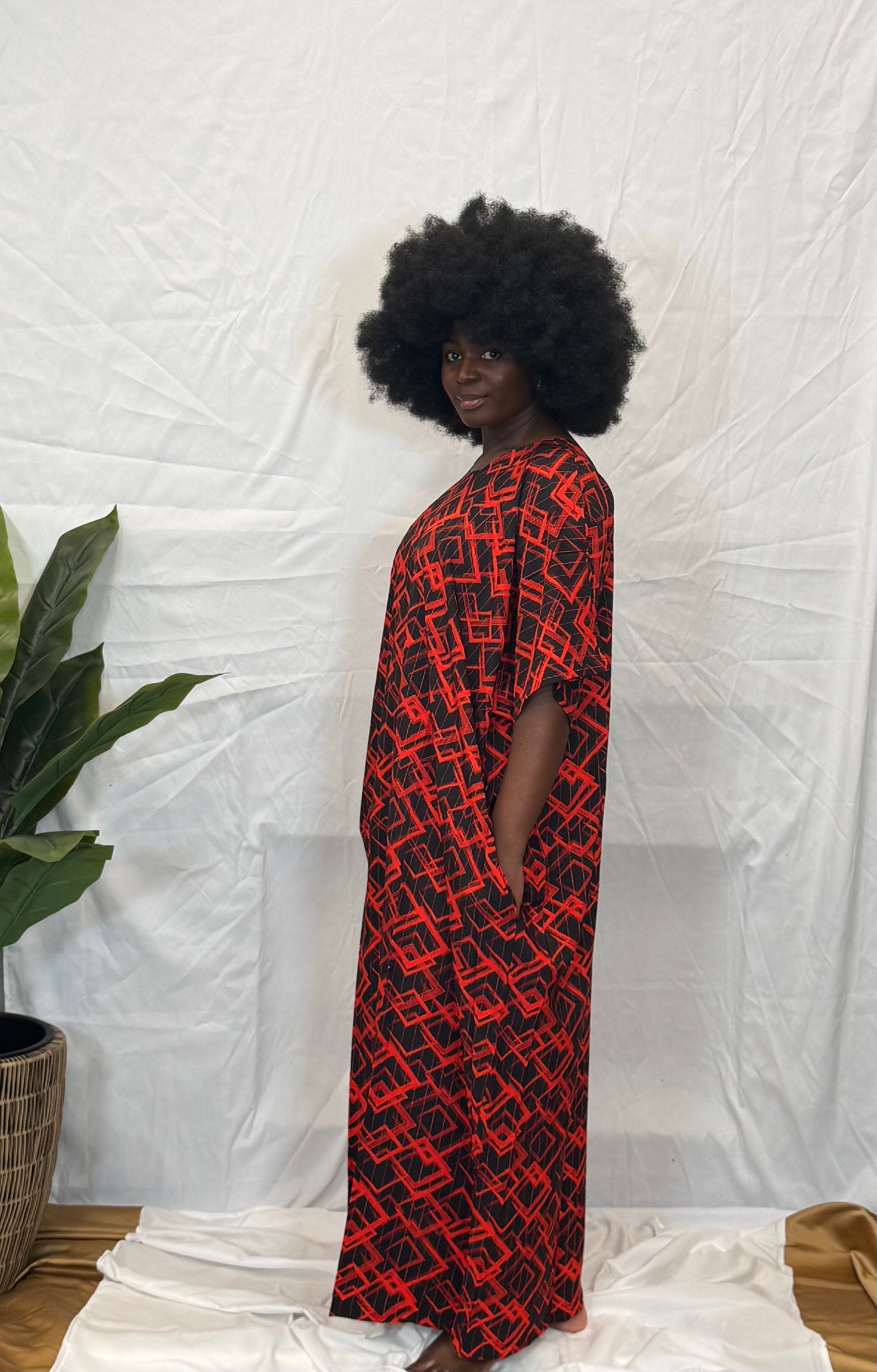 Black woman wearing bright colorful kaftan