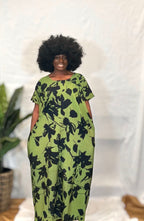 Black woman wearing bright colorful kaftan