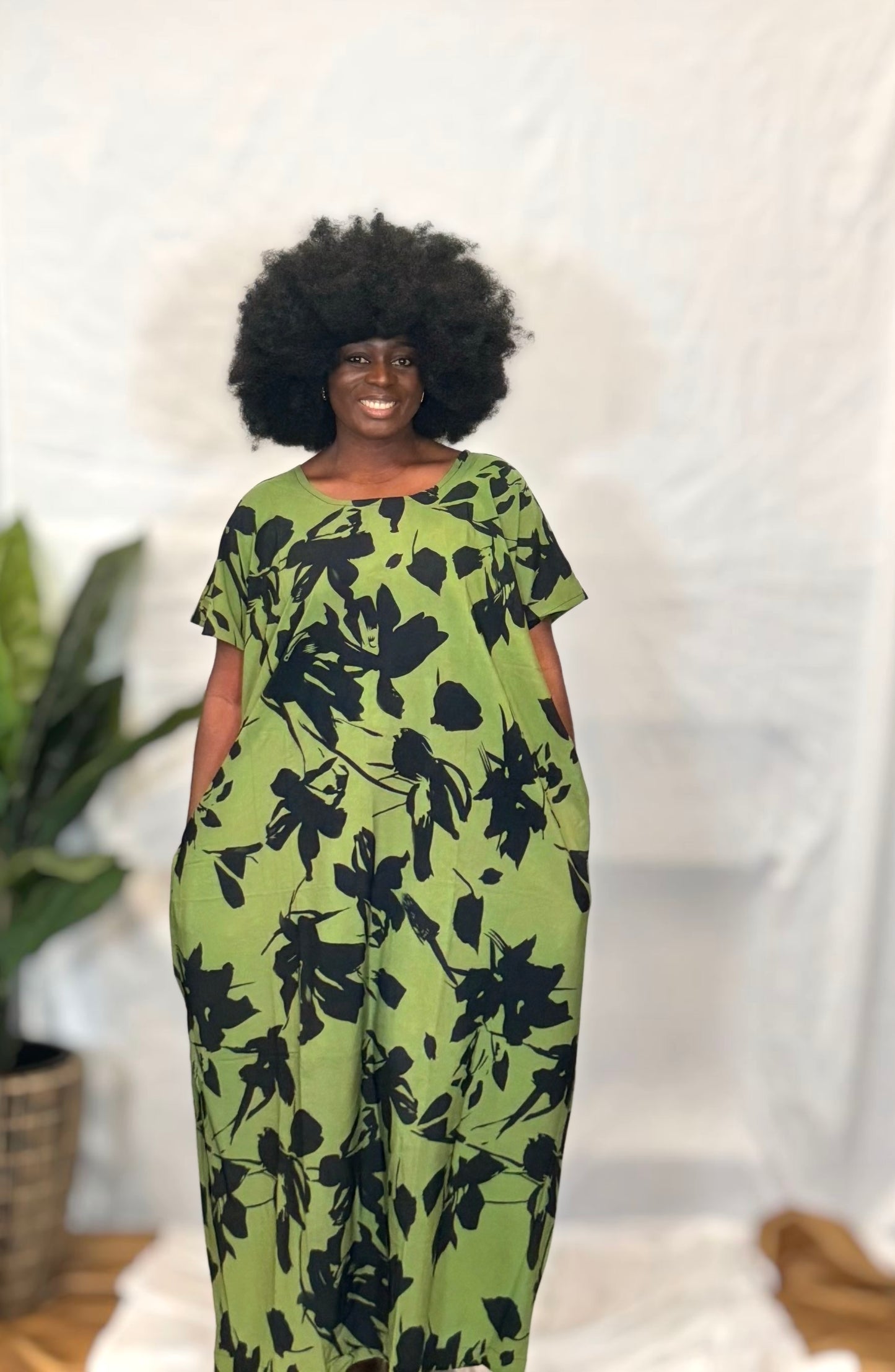 Black woman wearing bright colorful kaftan