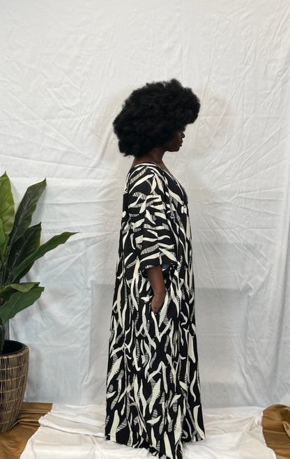 Black woman wearing bright colorful kaftan