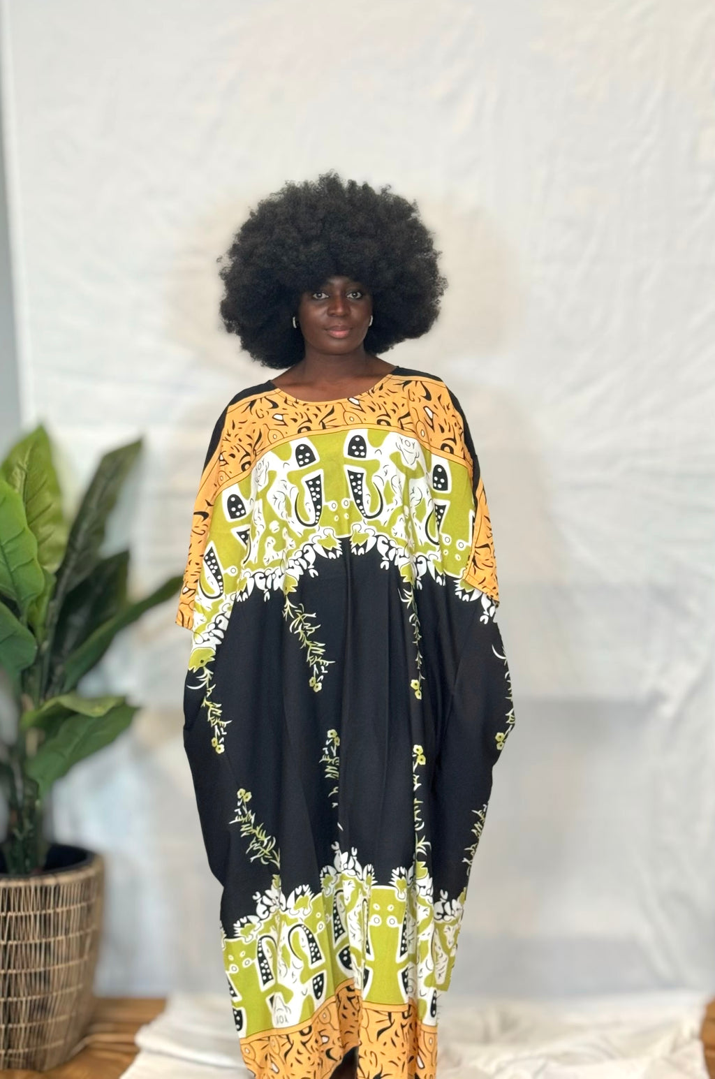 Black woman wearing colorful kaftan 