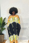 Black woman wearing colorful kaftan 