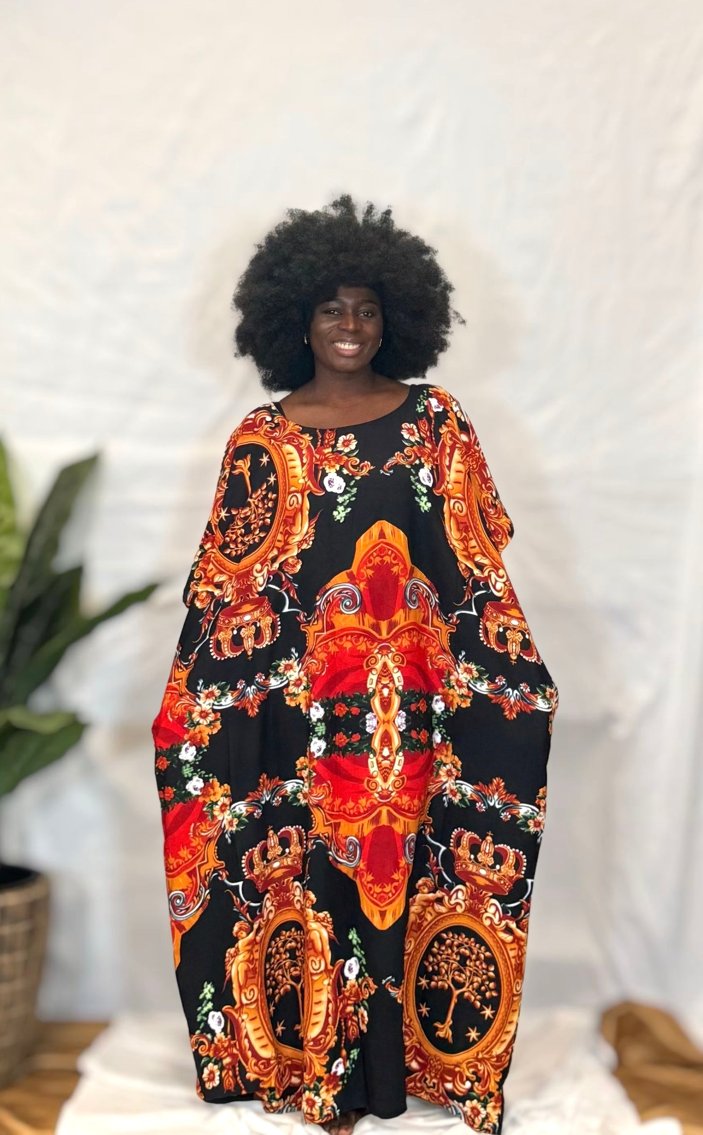Black woman wearing colorful kaftan 