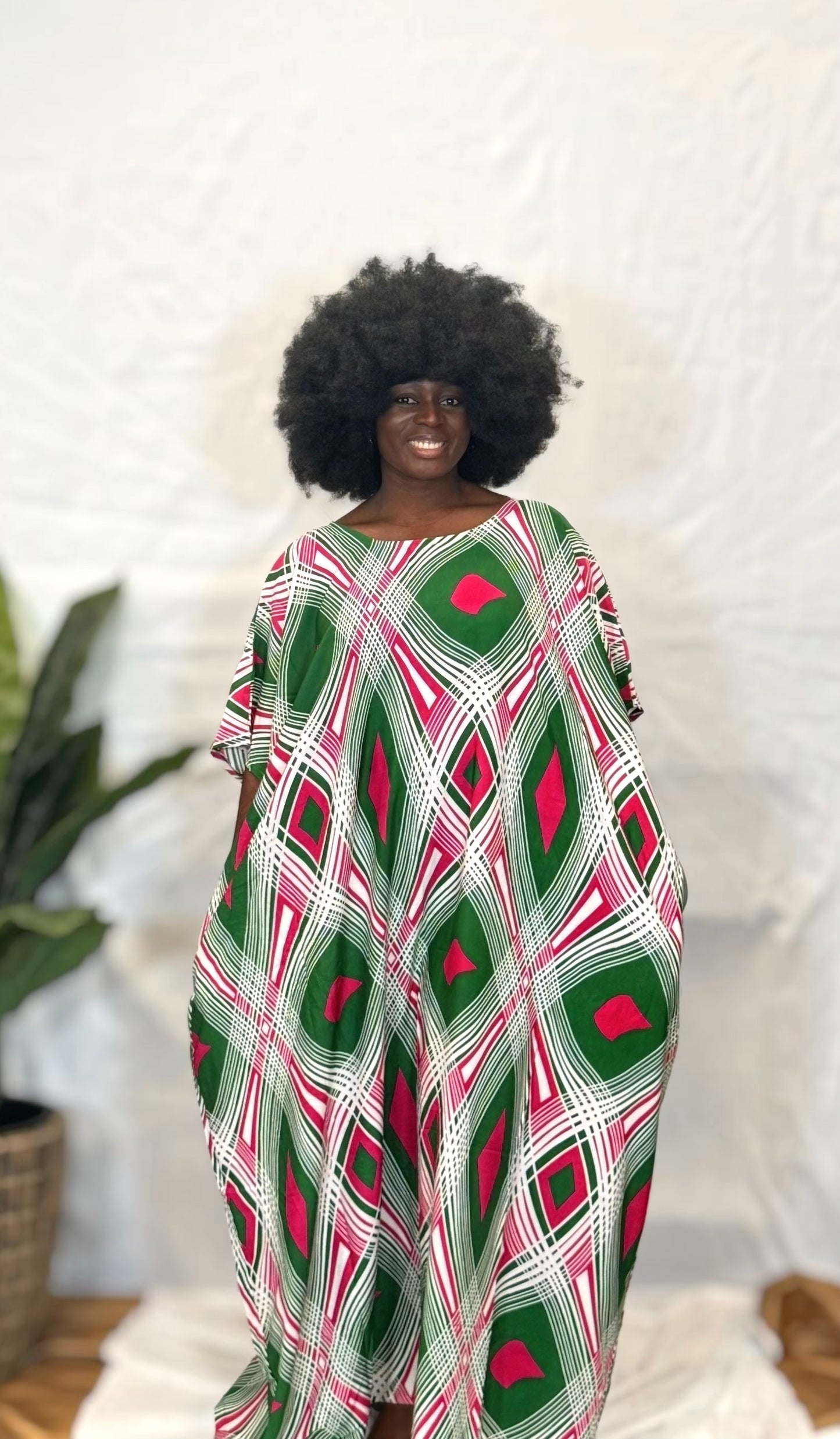 Black woman wearing bright colorful kaftan