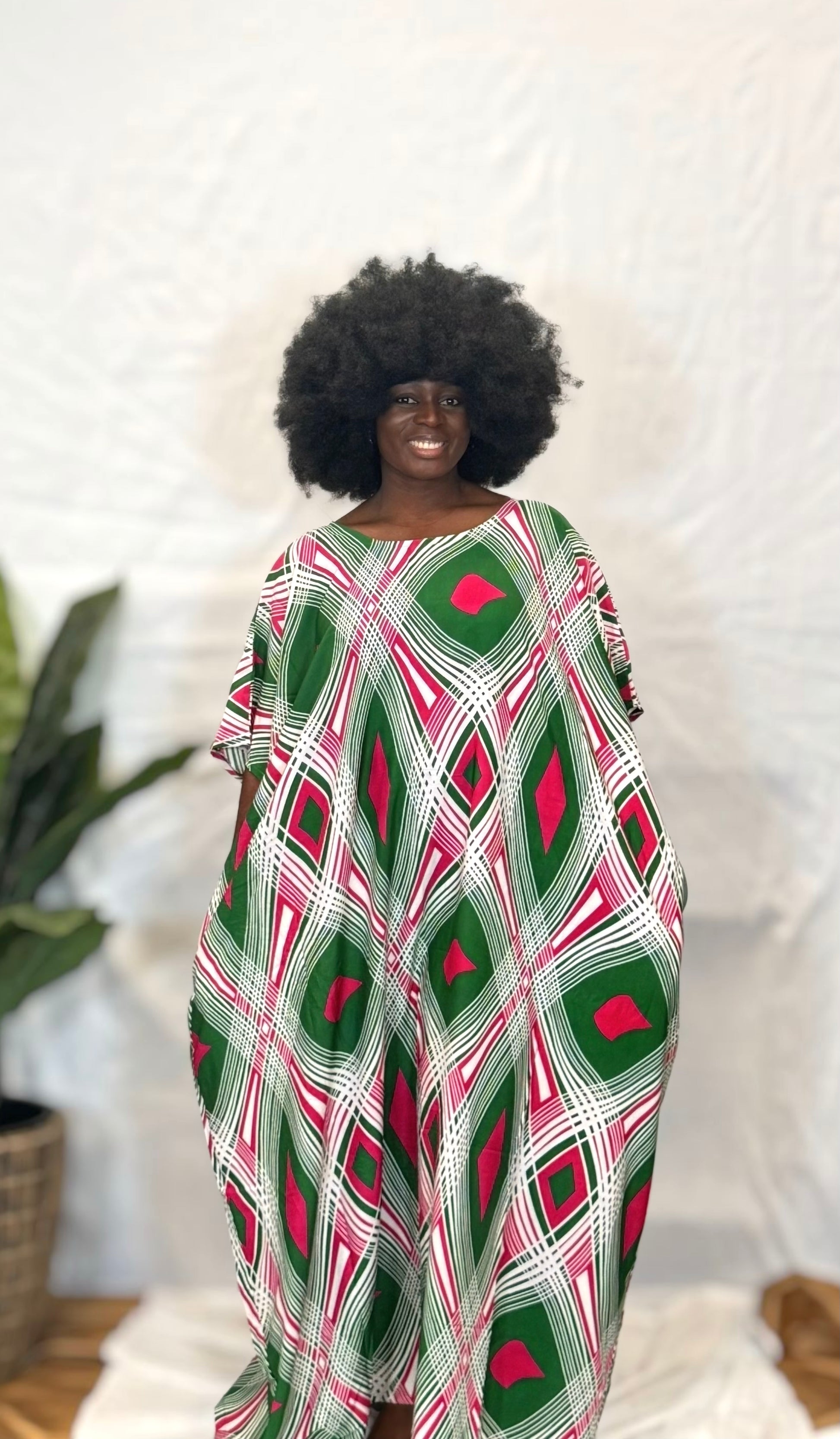 Black woman wearing bright colorful kaftan