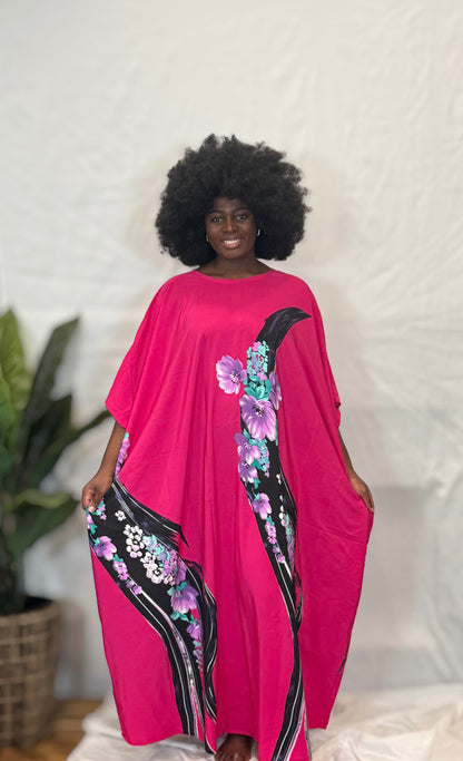Black woman wearing bright colorful kaftan