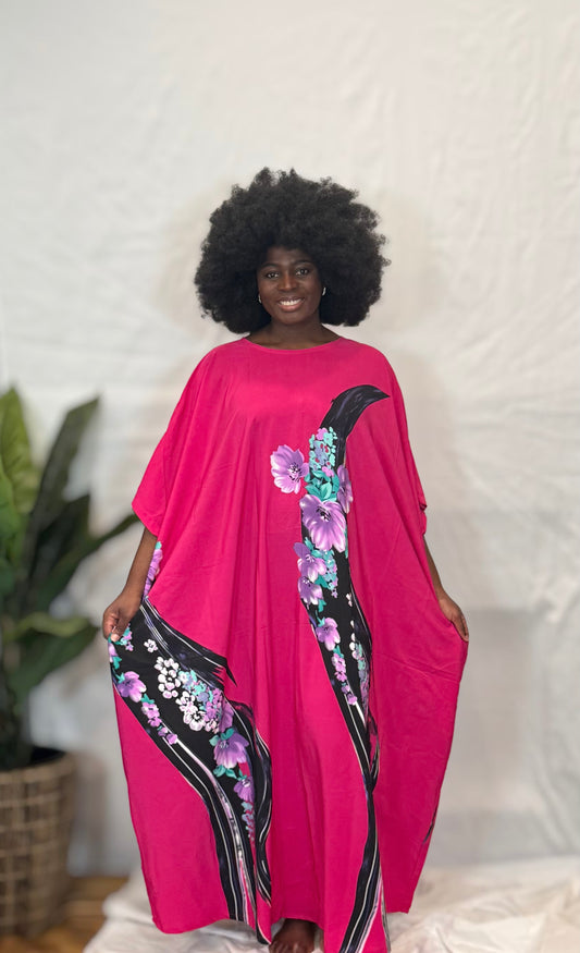Black woman wearing bright colorful kaftan