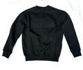 A person wearing a black sweatshirt with 'FAITH IN GOD' embroidered on the chest.