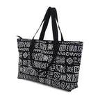 Black tote bag with white geometric pattern on a white background
