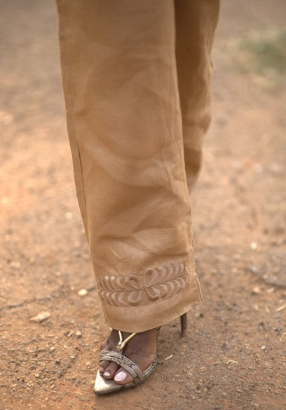 Young woman in linen shirt and pants set